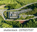 Aerial shot picturesque paradise of Sete Cidades in Azores, Sao Miguel. Volcanic craters and stunning lakes with abandoned Monte Palace hotel Ponta Delgada on hilltop, Portugal