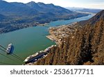 Aerial shot of the port of Juneau, Alaska, with cruise ships and mountains