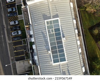 An Aerial Shot Of A Roof Of An Upscale Apartment Building With Parking Spot