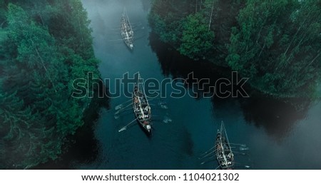 Aerial Shot of a Sailing Viking Row Ships on River. Medieval Reenactment.