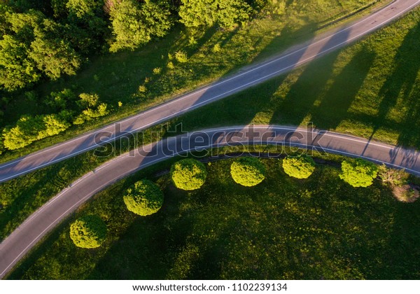 Aerial shot of some road in summer. Bird\'s eye\
view of a highway in\
Ukraine