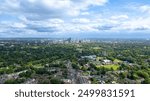 An aerial shot taken from a drone looking down the high street in Harborne towards the city centre during midday.