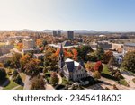 An aerial shot of the University of Massachusetts Amherst campus on a sunny autumn day