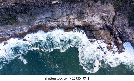 Aerial Shot Of Waves Crashing On The Coastline In Australia 