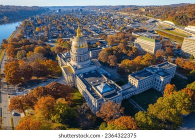 An aerial shot of the West Virginia State Capitol building and downtown Charleston in autumn.