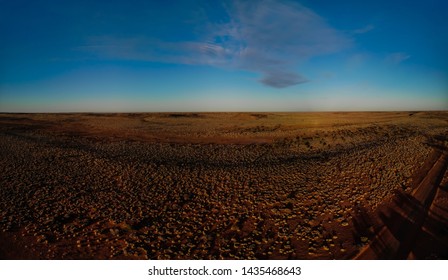 An Aerial Shot Of A Winter Sunset In Outback Australia, Red Dirt And Bush As Far As The Eye Can See.