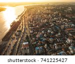 Aerial  shot,view from the drone on the road junction and city of Yangon near Rangoon river at sunset colors ,Myanmar