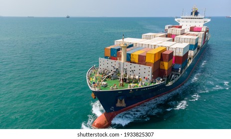 Aerial side view of smart cargo ship carrying container from custom container depot go to ocean concept freight shipping by ship service on blue sky background.