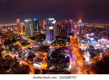 Aerial skyline of Downtown Taichung, the vibrant metropolis in central Taiwan, with modern skyscrapers towering in the 7th Redevelopment Zone and the city lights dazzling at blue dusk after sunset