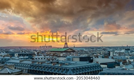 Similar – View of Paris with Eiffel tower silhouette at sunset