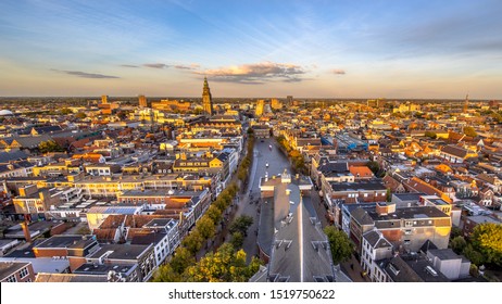 Aerial Skyline view of historic Groningen city centre at Vismarkt area under setting sun. The Netherlands