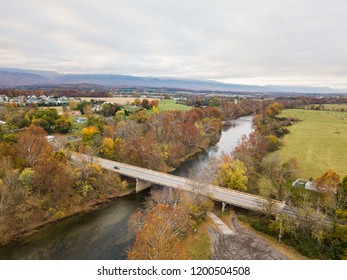 Aerial Of The Small Town Of Elkton, Virginia In The Shenandoah Valley With Mountains In The Far Distance