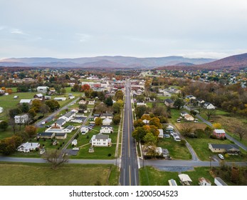 Aerial Of The Small Town Of Elkton, Virginia In The Shenandoah Valley With Mountains In The Far Distance