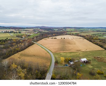 Aerial Of The Small Town Of Elkton, Virginia In The Shenandoah Valley With Mountains In The Far Distance