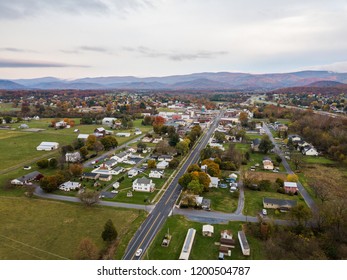 Aerial Of The Small Town Of Elkton, Virginia In The Shenandoah Valley With Mountains In The Far Distance