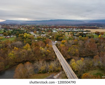 Aerial Of The Small Town Of Elkton, Virginia In The Shenandoah Valley With Mountains In The Far Distance