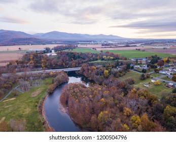 Aerial Of The Small Town Of Elkton, Virginia In The Shenandoah Valley With Mountains In The Far Distance