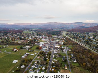 Aerial Of The Small Town Of Elkton, Virginia In The Shenandoah Valley With Mountains In The Far Distance