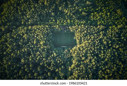 Aerial Of Soccer Pitch In The Forest Under Sunset Light