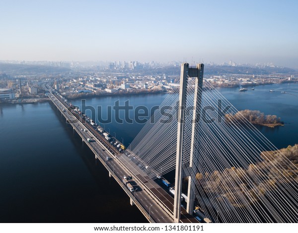 Aerial\
of the south bridge, city Kyiv Ukraine. South Bridge city of Kiev.\
The river of the Dnieper, the bridge crosses the river. City\
landscape from a bird\'s eye view bridge on\
river