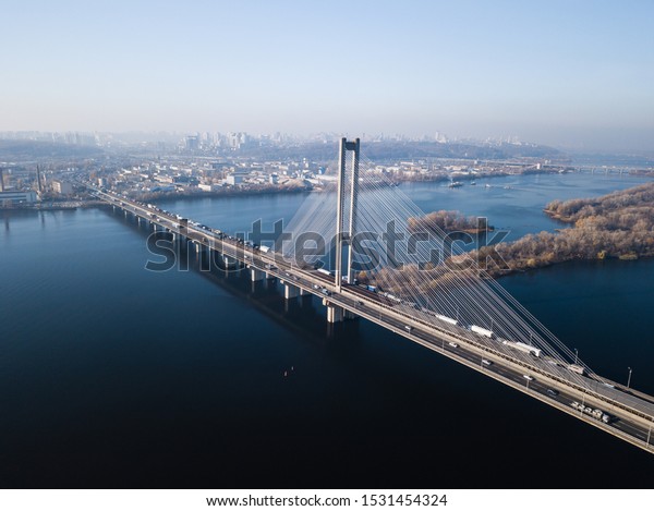 Aerial
of the south bridge, city Kyiv Ukraine. South Bridge city of Kiev.
The river of the Dnieper, the bridge crosses the river. City
landscape from a bird's eye view bridge on
river