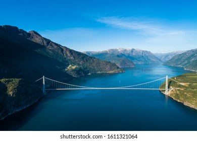 Aerial Summer Midday View Of Hardanger Suspension Bridge In Hardanger Fjord Connecting Oslo And Bergen , Norway