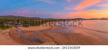 Aerial Summer Sunrise with soft high cloud at Umina Point in Umina Beach on the Central Coast, NSW, Australia.