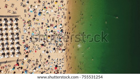 Similar – Aerial View From Flying Drone Of People Crowd Relaxing On Algarve Beach In Portugal