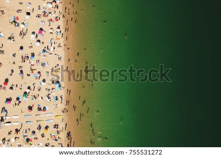 Similar – Aerial View From Flying Drone Of People Crowd Relaxing On Algarve Beach In Portugal