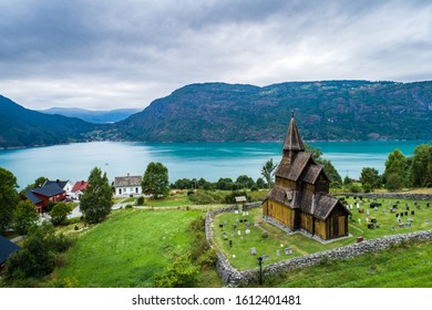 Aerial summer view of traditional Urnes rural village with Unesco Stave church in Lustrafjorden in Norway - Shutterstock ID 1612401481
