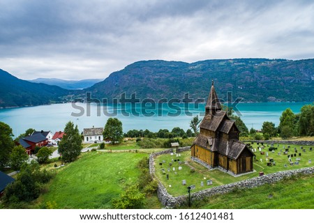 Aerial summer view of traditional Urnes rural village with Unesco Stave church in Lustrafjorden in Norway