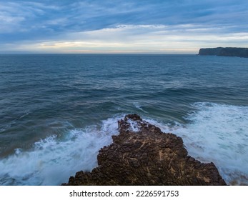 Aerial sunrise seascape with cloud covered sky and tessellated rock platform at North Avoca Beach on the Central Coast, NSW, Australia. - Shutterstock ID 2226591753