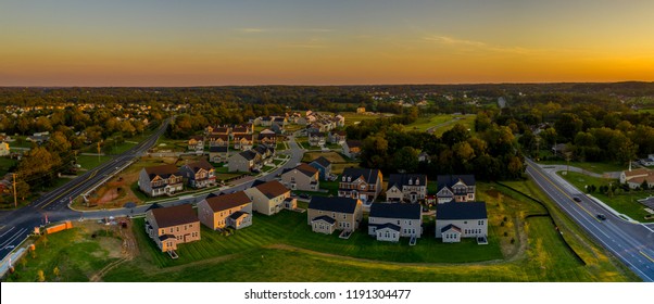 Aerial Sunset Landscape Of Typical American New Construction Neighborhood In Maryland For The Upper Middle Class, Single Family Homes