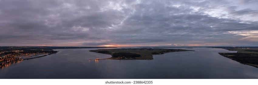 Aerial sunset panoramic view of Egholm, a Danish island in the Limfjord close to Aalborg. It can be reached by ferry.