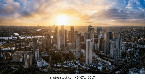 Aerial sunset view of the skyline of London with skyscrapers at Canary Wharf and the City in the background, England - Powered by Shutterstock