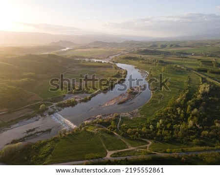 Aerial Sunset view of Struma river passing near village of Topolnitsa, Blagoevgrad region, Bulgaria