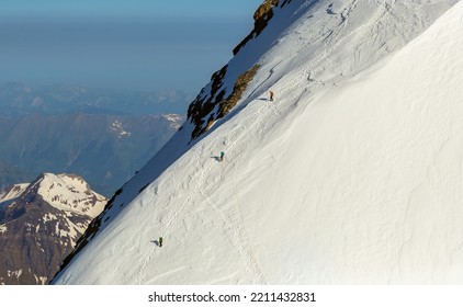 Aerial Switzerland Team Of Mountaineers Climbing Steep Mountain Snow Face Extreme Terrain The Alps Europe