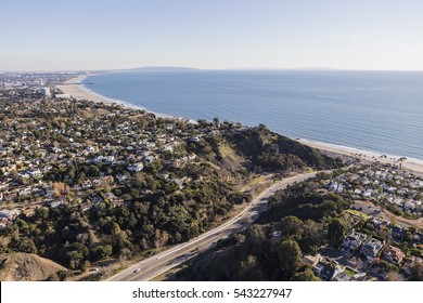 Aerial of Temescal Canyon Road and Pacific Palisades neighborhoods near Santa Monica Bay in Southern California. - Shutterstock ID 543227947