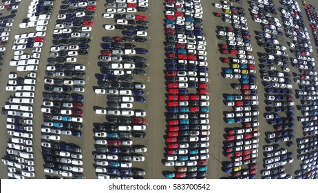 Aerial Top Down Bird View Of New Car Storage Parking Lot Showing Imported New Vehicles Ready To Export New Automobiles Storage Facility Car Industry For American And European Market For Car Sales Red