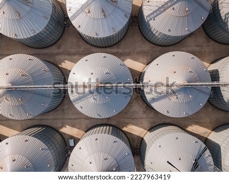 Aerial top down of grain elevator storage facility for wheat grains after harvesting
