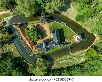 Aerial Top Down Ground Plan View Of Historic Monument Bannegon Castle In France With Wooden Draw Bridge Over The Water Filled Moat, Imposing Keep, Drawbridge, And A Trapezoidal Fortified Enclosure