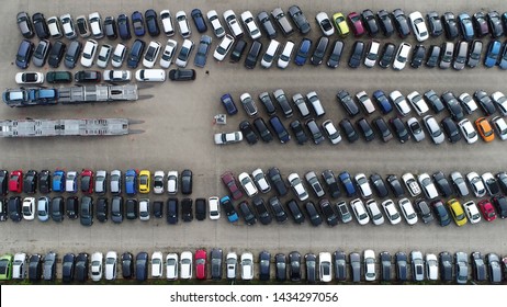 Aerial top down photo of car dealership or vehicle local distribution is a business that sells new or used cars at the retail level based on a contract with an automaker or its sales subsidiary