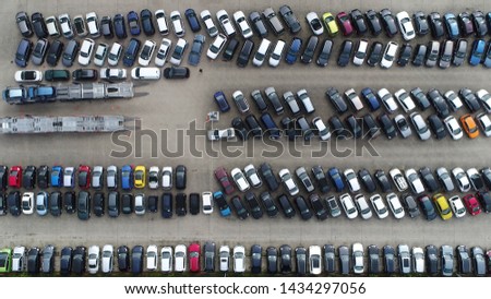 Aerial top down photo of car dealership or vehicle local distribution is a business that sells new or used cars at the retail level based on a contract with an automaker or its sales subsidiary