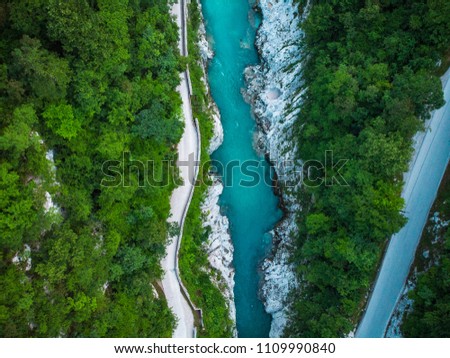 Aerial top down photo of road and Soca river in Slovenia.