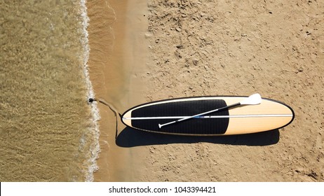 Aerial top down photo of sup board or Stand Up Paddle board as seen in tropical beach shore