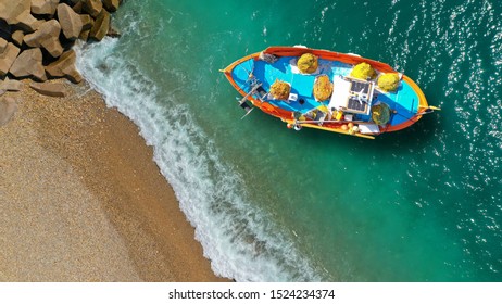 Aerial top down photo of traditional fishing boat docked in emerald island bay - Shutterstock ID 1524234374