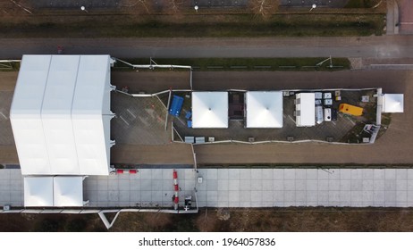 Aerial Top Down Picture Of Corona Covid-19 Test Site Drive Through Center Showing The White Pop-up Tents And Way To Enter The Location Usefull For Rapid Testing During 2019 2020 Pandemic