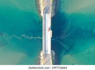 Aerial Top Down Shot Of Causeway Road Across Body Of Water