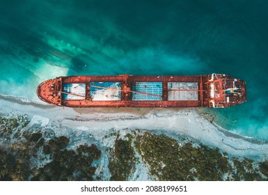 Aerial Top Down View Of An Abandoned Bulk-carrier Dry Cargo Ship Washed Ashore After A Storm