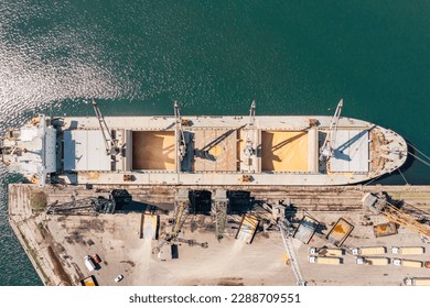 Aerial Top down view Black Sea port Loading of dry cargo ship with ukranian grain by cranes. Maritime grain Import and export concept - Shutterstock ID 2288709551